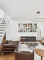 modern design, white walls, wooden floor, white staircase, large windows, city view, modern furniture