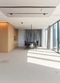 modern office room with wooden floor, large glass windows, table and chairs, wooden storage units, curtain