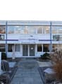 2 story building, modern glass windows, signage reading "Wunschräume.ch"