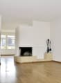 empty room, fireplace, wooden floor, white walls
