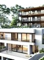Modern two-story house with balconies, raised ground floor, and garage