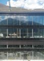 modern office building, glass facade, multiple floors, mountain view