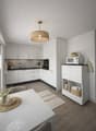 modern kitchen with white cabinets, black countertops, microwave, oven, sink, faucet, wooden floor, dining table, chairs, decorative items