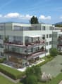Apartment complex, multiple floors, balconies on each floor, community playground