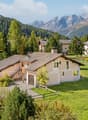 2 story house, brown roof, beige walls, garage, open front yard, scenic mountain view