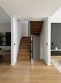 modern interior, wooden stairs, white walls, wooden flooring