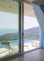 spacious interior, glass sliding doors, pool, lounge chair, ocean view