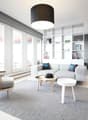 ample windows, gray couch, wooden table, floor lamp, wooden chair, carpet