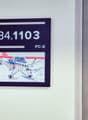 The image shows a framed display with the number 34.1103 and the text 'PC-6' below it. The display also includes an image of a small propeller plane on a snowy surface.