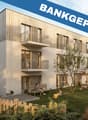 modern apartment building, white exterior, wooden balconies, large windows, garden, playground