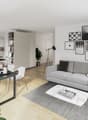 Minimalist living room with dining area, light colored furniture, and decor.