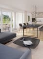 modern living room with large windows, gray sofa, black coffee table, dining table with chairs, kitchen with modern appliances, chandelier