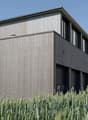 modern building, wood paneling, 2 stories, 2 garages