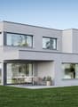 modern two-story house, gray exterior, large glass windows, balcony, garden furniture, lawn