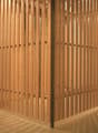 Wooden storage room with a basket filled with bottles