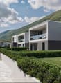 multiple story apartment complex, gray concrete exterior, underground parking garage, multiple outdoor terraces, raised ground floor, mountain view