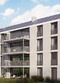 modern apartment building, solar panels on the roof, balconies on each floor, white exterior, large windows