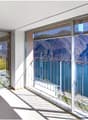 large terrace, panoramic view, glass sliding doors, beige flooring