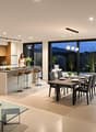 modern design, island countertop, built-in appliances, large windows, dining area, sitting area, modern flooring, pendant lighting