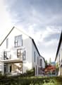 Modern 2 story house, white exterior, multiple windows, terrace, garden, surrounding trees