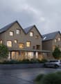Modern 2-story house, brown exterior, large windows, solar panels, driveway, car parked, garden, trees