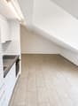 empty kitchen with tiled floor, white cabinets, stainless steel sink, electric stove, ceiling light