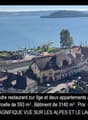 Aerial view of village, houses, restaurant, buildings, water body, mountains, greenery, train tracks