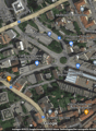 Aerial view of a city area with various landmarks, businesses, and establishments.