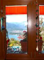 window, plants, decorative item, view to lake and mountain