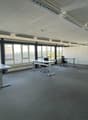 Large office space, 3 desks, 4 chairs, large windows, carpet floor