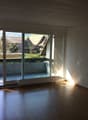 sliding glass doors, balcony, white wall, wooden floor, empty room