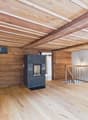 wooden walls, wooden floor, fireplace, staircase