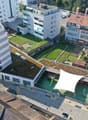 apartment building, office building, playground, car park, residential buildings, green roof