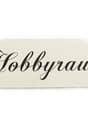 White sign with 'Hobbyraum' written in black cursive font