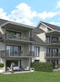 A two-story house with balconies, solar panels on the roof, white outdoor furniture, and a grassy yard.