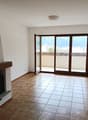 tiled floor, Fireplace, balcony, sliding glass doors, balcony with view