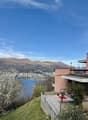 modern house, elevated, balcony, lake view, mountains