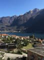Mountain view, lake view, town view, multiple houses, trees, mountains