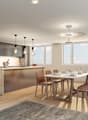 kitchen island, large dining table, chairs, wooden floors, modern lighting, large windows