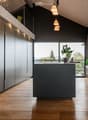 kitchen, island, plants, modern style, windows, grey cabinets, wooden floor, pendant lights