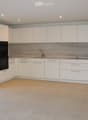 white kitchen, marble countertops, double oven, sink, faucet, glass windows, tiled floor