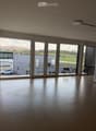 large windows, balcony, view of the outside, empty room