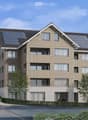 3 story apartment house, solar panels on the roof, driveway