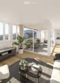 Modern living room with large windows offering a scenic view, featuring a grey sofa, coffee table, side table, bookshelf, and potted plants.