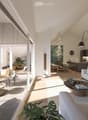 Modern living room with a grey sofa, coffee table, dining area, and kitchen island. Features large windows, wooden flooring, and contemporary decor.