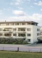 Modern two-story residential building with white facade, large windows, balconies, and a garage entrance.