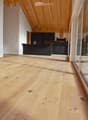 open space, wooden floor, wooden ceiling, large windows, kitchen island, cabinets, drawers