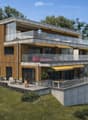 Modern two-story house with wooden and concrete exterior, multiple balconies, raised ground floor, and outdoor seating areas.