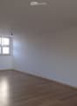 empty room, white walls, wooden floor, window, power outlets