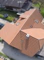 Modern two story house, red roof, outdoor swimming pool